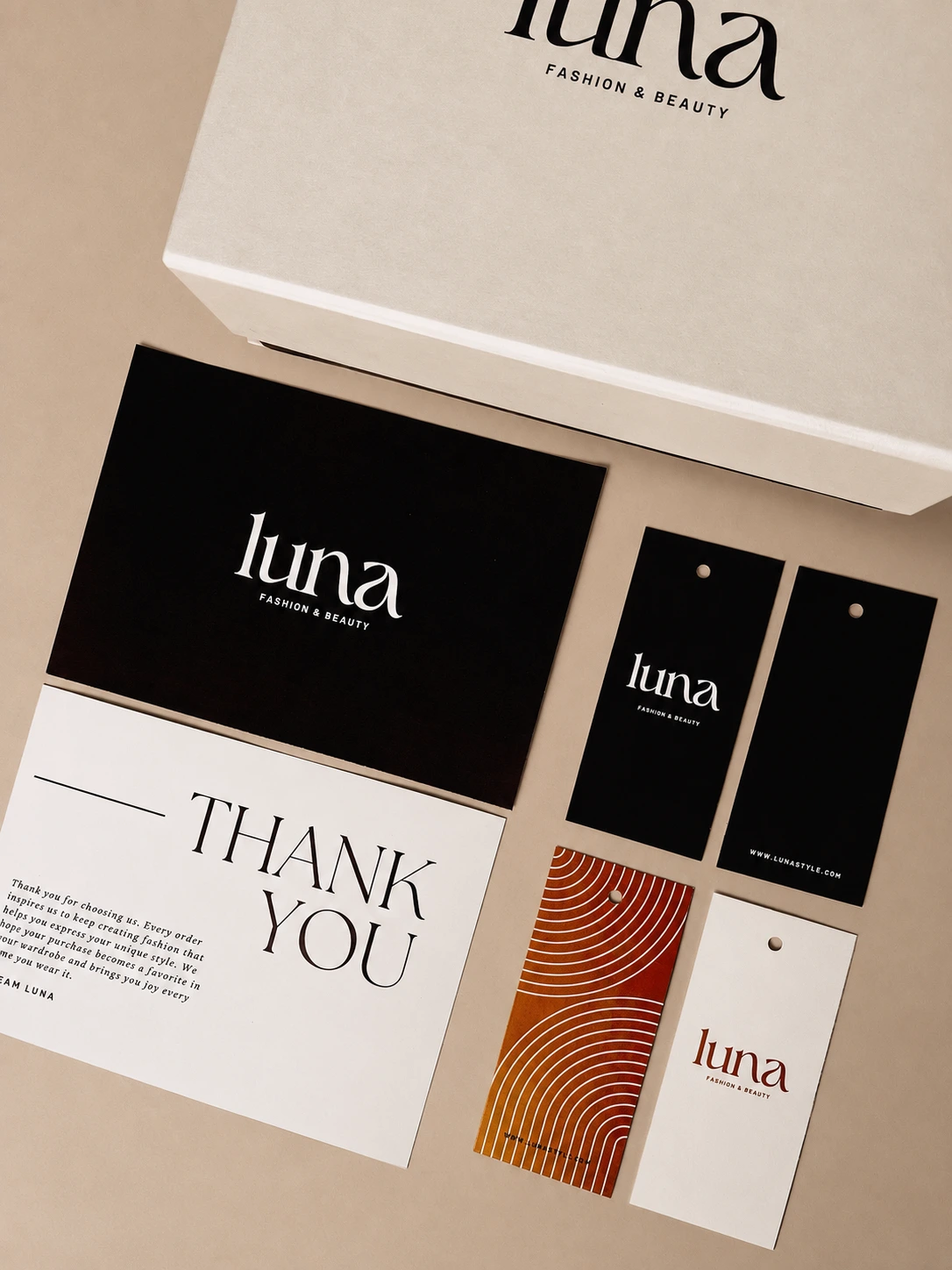 Complete fashion brand packaging suite arranged for an unboxing presentation